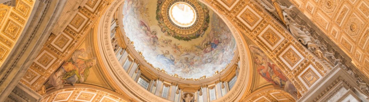 Vatican City, Rome, Italy - February 23, 2019: Interior ceiling of the Basilica of the Holy Apostle Peter in the Vatican, yellow color dome inside. Famous landmark in Rome.